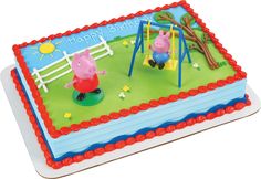 a birthday cake with pepo and piggy on the swings in front of it