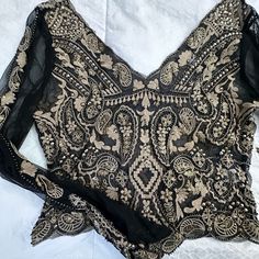 Gorgeous Venus Top. Sheer W/ Embroidery And Beading On The Front. Back Is Also Embroidered No Beading. Slight Bell Sleeves. Cropped Top. Size 6/ Medium. Never Worn. Extra Beads Still Attached. Black Embroidered Formal Tops, Formal Black Embroidered Tops, Elegant Evening Blouse With Intricate Embroidery, Evening Embroidered Sequins Fabric, Elegant Long Sleeve Embellished Embroidered Fabric, Black Embellished Embroidered Fitted Fabric, Fitted Black Embellished Embroidered Fabric, Fitted Black Embroidered And Embellished Fabric, Elegant Black Long Sleeve Embroidered Top