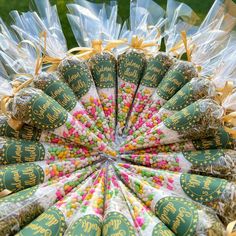 many bags of candy are arranged in the shape of a flower arrangement with words on them