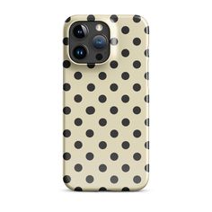 an iphone case with black and white polka dot pattern on it, showing the camera lens