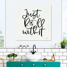 a bathroom wall hanging above a sink with the words just do it written on it