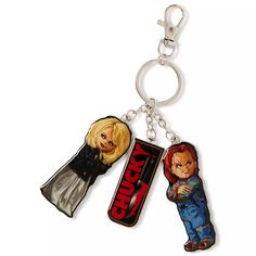 two key chains with the characters of chucky and chucky on them, one is holding