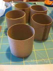 four brown cups sitting on top of a table