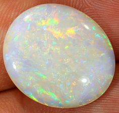 a white opalite in someone's hand