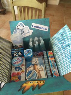 an open box filled with various items sitting on top of a table