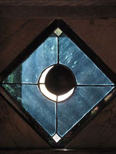 a stained glass window with a crescent in the center