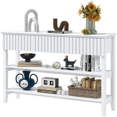 a white book shelf with books and vases on it's sides, against a white background