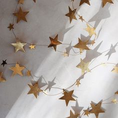 some gold stars are hanging on the wall