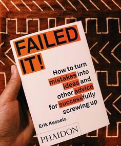 a person holding up a book with an orange and black cover that reads failed it how to turn stakes into ideas and other advice for successfully scrawing up