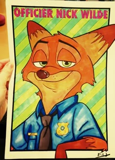 a person holding up a drawing of a fox with the words officer nick wilde on it