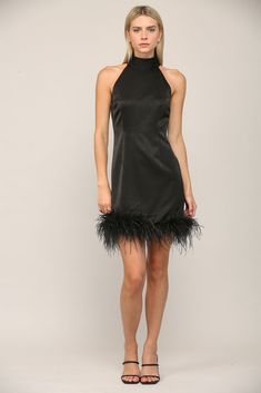 -Color: Black -Halter neck styling with hook and eye closure -Polyester blend -Silk feel like fabric with faux feather hem -Dry clean recommended -Content: Self: 90% Polyester 10% Spandex /Lining: 92% Polyester 8% Spandex -Imported -We recommend to size up if in between sizes -Model is wearing size Small Elegant Feather Mini Dress For Club, Elegant Mini Dress With Feathers For Club, Elegant Club Mini Dress With Feather Trim, Fitted Mini Dress With Feather Trim For Date Night, Chic Fitted Mini Dress With Feather Trim, Chic Mini Dress With Feather Trim, Chic Feathered Club Dress, Chic Feather Trim Club Dress, Chic Mini Dress With Feathers