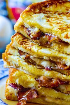 bacon stuffed french toast stacked on top of each other with text overlay that reads, bacon stuffed french toast