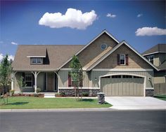 a large house with two garages on the front