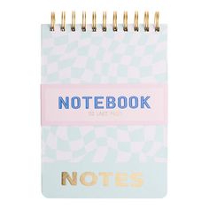 a notebook with the words notes written in gold and blue on it, next to a pink ribbon