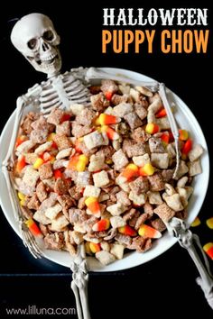 a white plate topped with halloween puppy chow next to candy corn and a skeleton on the side