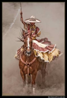 a woman riding on the back of a brown horse wearing a sombrero and holding an umbrella