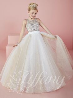 Your sweet girl will light up the room in this beaded long sleeveless illusion dress with A-line skirt by Tiffany Princess 13476. The bodice of this pageant gown is adorned with AB rhinestones in a jewelry style. The waistband is pleated on the gathered tulle ball gown skirt with a sparkle tulle overlay. House of Wu Tiffany Princess Collection Fall 2016 Style Number: 13476 Fabric: Sparkle Tulle Silhouette: Ball Gown, A-line Neckline: Illusion Sleeves: Sleeveless Colors: Ivory/Champagne, Lilac/Ch Military Ball Dresses, Girls Pageant Dresses, Beaded Tulle, Ball Gown Skirt, Tulle Ball Gown, Pageant Gowns, Sweetheart Dress, Pageant Dress, Junior Bridesmaid Dresses