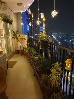 a balcony with potted plants and lights