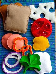 felt food items laid out on a blue mat