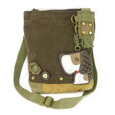 Casual, Fun, Practical. This patch crossbody bag is a great way to be fashionable and fun while supporting rescued farm animals. All proceeds go to our rescued animals at Rooterville Sanctuary. Comes with detachable Toffy Dog Key Fob/Coin Purse Wooded flower and heart-shaped buttonTop zip closureBrass toned hardwareInner zipper and slide pocketsMaterials: Washed cotton canvas, faux leatherColor: Sand / Dark Brown / Brown / Olive / Mauve / DenimDimensions: 9.5" x 11" x 3.5"Strap adjustable: 13"~2 Chala Handbag, Dog Patch, Animal Bag, Dog Charm, Dog Bag, Leather Coin Purse, Dog Charms, Canvas Gift, Cute Bags