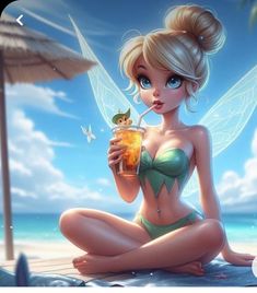 a beautiful woman sitting on top of a beach holding a drink