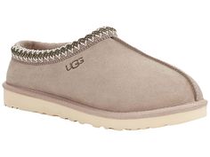 UGG Tasman - Men's Slippers : Putty : Casual, yet rugged, classic slipper. The Tasman always fits tight at first especially if someone has a high instep or high volume foot. It does stretch out over time. If you are in between sizes, please size up or down based on the volume of your foot and height of your instep. The UGG Tasman is a casual, yet rugged, classic slipper. Sheepskin laminated to cow suede adds durability to uncompromised comfort. Sheepskin laminated to cow suede adds durability to Classic Closed Toe Slip-ons With Textured Footbed, Slip-ons With Arch Support And Round Toe, Slip-ons With Arch Support, Classic Slippers With Cushioned Footbed And Flat Heel, Classic Slip-on Slippers With Textured Footbed, Comfortable Slip-on Slippers With Arch Support, Comfortable Slippers With Arch Support And Round Toe, Comfortable Round Toe Slippers With Arch Support, Comfortable Arch Support Round Toe Slippers