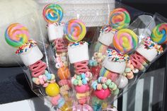 some lollipops and marshmallows in plastic bags