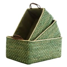 a green basket with three pieces of cloth in it