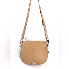 Rag & Bone!! Designer Brand Without The Designer Price. How? This Purse! This Rag & Bone Rb02956-016 Tan Pebbled Leather Small Rounded Crossbody / Shoulder Bag Has A Front Flap And Is Ready For Your Adventures. The Back Has A Magnetic Closure Pocket That Most Phones Will Fit In. On The Front, Under The Magnetic Cloruse Flap Is A Slip Pocket. The Main Section Has A Zipped Pocket. Very Good Condition. Normal Wear. Spots Around. Some Wear To Edge Trim On Top Sides Of Purse (See Last 2 Pics). This I Classic Crossbody Saddle Bag With Silver-tone Hardware, Classic Saddle Crossbody Bag With Silver-tone Hardware, Flap Bag With Silver-tone Hardware, Beige Satchel With Metal Hardware, Beige Saddle Bag With Detachable Strap, Beige Flap Bag With Metal Hardware For Everyday Use, Everyday Crossbody Flap Bag With Silver-tone Hardware, Beige Leather Flap Bag With Metal Hardware, Chic Saddle Bag With Silver-tone Hardware For Travel