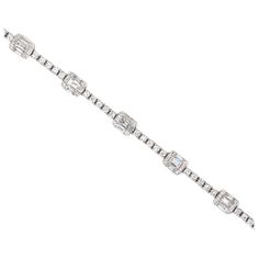 18K White gold tennis bracelet featuring 55 baguette diamonds weighing 1.59 carats flanked with 99 round brilliants weighing 1.12 carats. Color G-H Clarity SI Diamond Tennis Bracelet With 17 Jewels And Baguette Cut, Diamond Baguette Cut Tennis Bracelet, Baguette Diamond Bracelet, Baguette Cut Single Diamond Tennis Bracelet, Formal Baguette Cut Tennis Bracelet With Baguette Diamonds, Bracelets Tennis, Gold Tennis Bracelet, Diamond Baguette, Bracelet Tennis