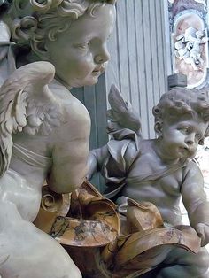 Puttos adorning one of two Holy Water fonts at St Peter's Basilica