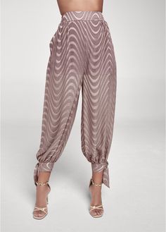 Meet the dressed up jogger you didn't know you needed! Now you can rock your favorite lounge pant silhouette at brunch or out to dinner in floaty, lightweight chiffon. Sash ties wrap around the ankle to complete the elegant high-waisted style with the allover wavy pattern amping up the boldness.* Sizes: XS (2), S (4-6), M (8-10), L (12-14), XL (16)* High waist* Pull-on pants with back elastic waist* Adjustable ties at leg openings* Sheer with 2" shorts lining* Print placement may vary* 24" insea Draping Fashion, Wavy Pattern, High Waist Fashion, Print Placement, Online Fashion Stores, Unique Outfits, Disney Style, Pull On Pants, Lounge Pants