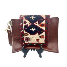 This Hand-Crafted Tirsheh Handcraft Wristlet/Clutch Bag Is A Unique Item Made Of Leather And A 70 Year Old Hand-Woven Persian Rug. Its Bohemian Design Make It Perfect For A Casual, Festival Or Travel Occasions. The Bag Features A Magnetic Closure And A Width Of 10.5 Inches And A Height Of 8 Inches. The Strap Is Made Of Brown Leather And Accented With Gold Hardware, The Handle Attaches Via A Large Lobster Clasp And Can Be Removed To Convert Into A Clutch. New With Tags. Rectangular Everyday Bag With Wrist Strap, Leather Handle Pouch Clutch For Travel, Clutch Bags With Wrist Strap As Gifts, Rectangular Clutch With Leather Handles For Travel, Brown Rectangular Clutch With Adjustable Strap, Brown Leather Satchel Clutch With Handles, Leather Handheld Bag With Wrist Strap, Square Clutch With Adjustable Strap For Travel, Square Clutch With Detachable Handle For Travel