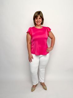 Upgrade your fashion with our Pink Satin Ruffle Sleeve Top! Made from luxurious pink satin-like material, this top features stunning ruffled sleeves that add a touch of elegance and femininity. Perfect for any occasion, this top will make you feel confident and stylish with its sophisticated look. Satin like fabric Round neck Ruffle tulip cap sleeves Back keyhole button closure Available S-2X True to size Modeled in size small Free shipping over $100. Feminine Pink Satin Top, Pink Satin Feminine Blouse, Pink Satin Blouse In Feminine Style, Pink Ruffle Sleeve Blouse For Work, Chic Satin Ruffled Tops, Chic Satin Tops With Ruffles, Elegant Pink Stretch Top, Chic Stretch Blouse With Ruffle Sleeves, Chic Stretch Satin Blouse