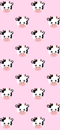 a pink background with black and white cows on it