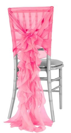 a chair with a pink ruffled sash on it's back and silver legs