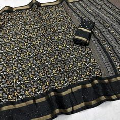 Black colored saree is made from Georgette fabric which is highlighted with beautiful warli print work as shown. Comes along with unstitched banglori silk blouse piece which you can customise as per your design/style. Occasion - You can wear this saree for Casual and functuons. Note:- the actual product may differ slightly in color and design from the one illustrated in the images when compared with computer or mobile screen. Measurements: Saree : Georgette : 5.5 Mtrs Blouse : Georgette : 0.8 Mt Black Handloom Tussar Silk Blouse Piece, Black Tussar Silk Handloom Blouse Piece, Semi-stitched Cotton Saree With Bandhani Print, Traditional Black Dupatta With Kalamkari Print, Bollywood Style Black Dupatta With Kalamkari Print, Black Saree With Printed Border Fabric Only, Navratri Cotton Silk Saree With Printed Border, Black Saree With Printed Border Unstitched, Unstitched Black Saree With Printed Border