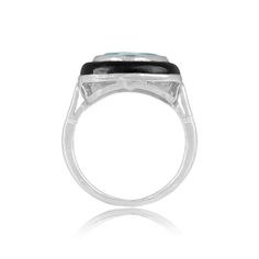 a black and white stone ring on a white background