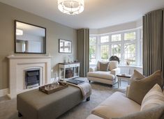 a living room filled with furniture and a fire place