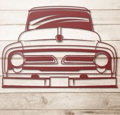 an image of a red car cut out on the wood wall with white planks