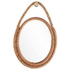 a round mirror hanging on a rope