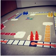 a board game with traffic cones on the floor