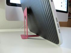 a computer monitor sitting on top of a desk