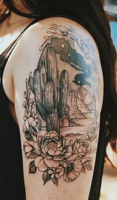 a woman's arm with a cactus and flowers tattoo on the left side of her arm