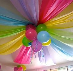 the ceiling is decorated with balloons and streamers