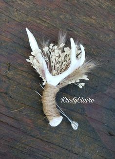 some white feathers and other things on a wooden surface