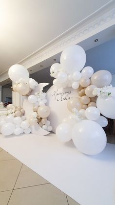 balloons and flowers decorate the entrance to a reception room at a private residence in england