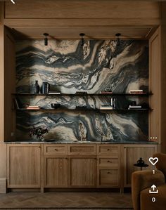 a living room with wooden shelves and marbled walls