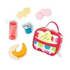 an assortment of toys including a lunch box, pacifier and other items on a white background