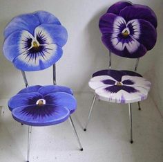 three purple and white chairs sitting next to each other